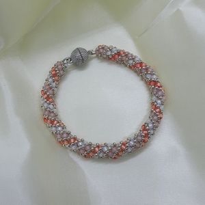 Peach, white and pink hand beaded bracelet